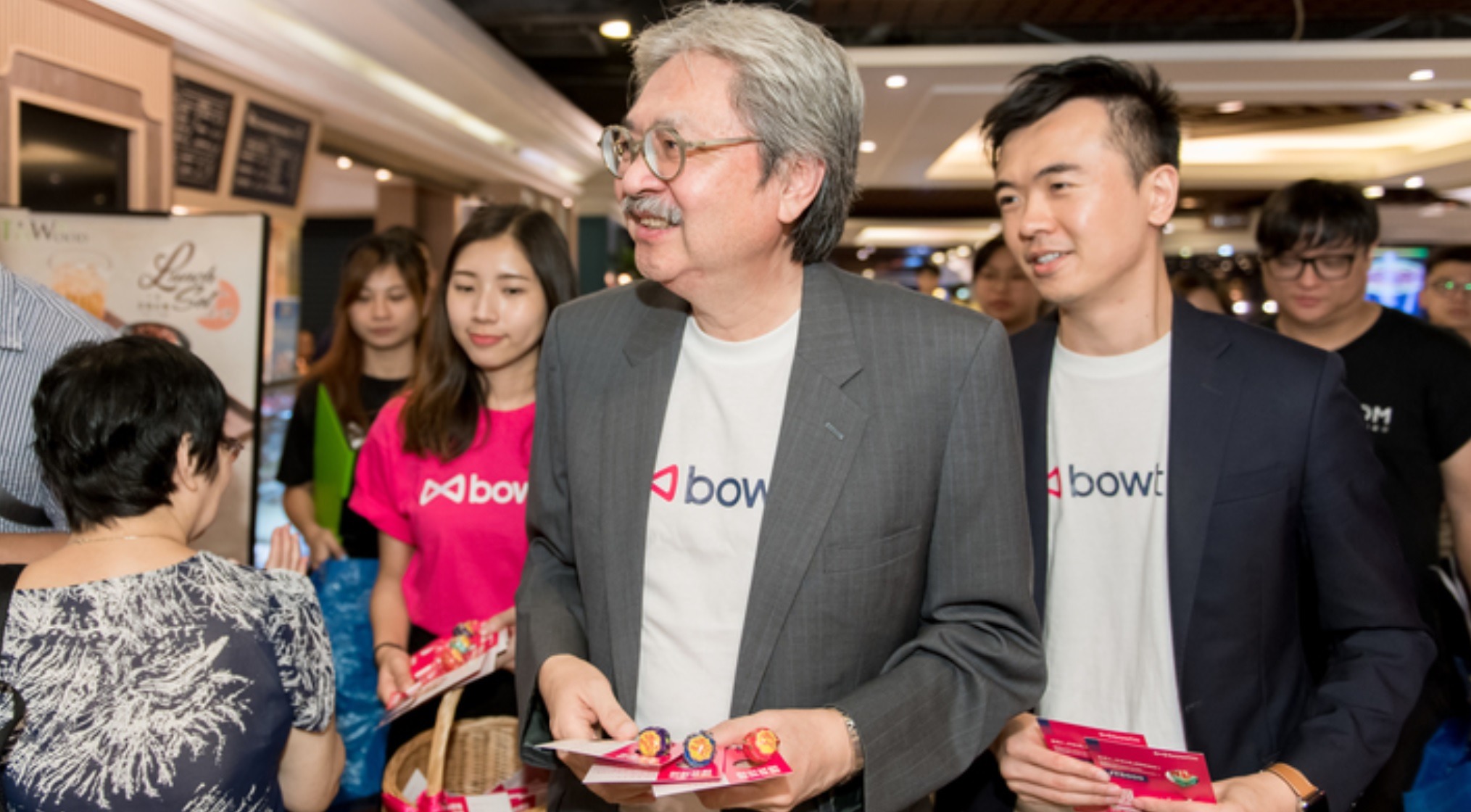 John Tsang handing out sweeteners to Hong Kong citizen